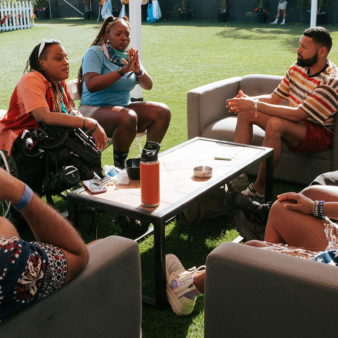 fans chatting around a table